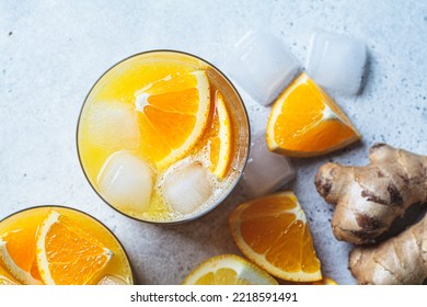 Orange Lemon Juice With Ginger And Spices In A Glass, Gray Background, Top View. Immunity Boosting Drink, Health Concept, Recipe For Colds.