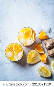 Orange Lemon Juice With Ginger And Spices In A Glass, Gray Background, Top View. Immunity Boosting Drink, Health Concept, Recipe For Colds.