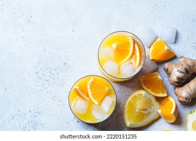 Orange Lemon Juice With Ginger And Spices In A Glass, Gray Background, Top View. Immunity Boosting Drink, Health Concept, Recipe For Colds.