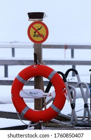 Orange Life Buoy Under No Diving Sign In Lapland 