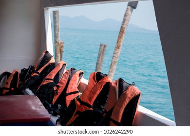 Orange Life Jackets On Travel Boat.Concept Accident In The Boat.