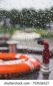 Orange Life Preserver On A Boat During A Rain Storm, Shallow Depth Of Field