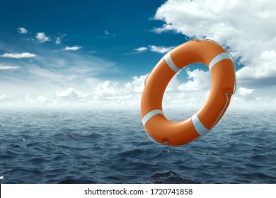 Orange Lifebuoy on the water. The concept of help, rescue, drowning, storm. Copy space