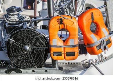 Orange lifebuoys and black rope, safety equipment of modern yacht - Powered by Shutterstock