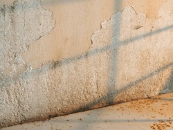 Orange Light Shadow Reflected On Old Cement Wall With Shadow Lines For Vintage Background.
