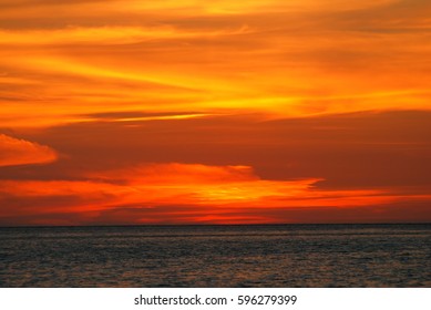 Orange light in the twilight on sea. - Shutterstock ID 596279399