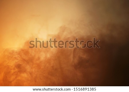 Orange lighted smoke background texture