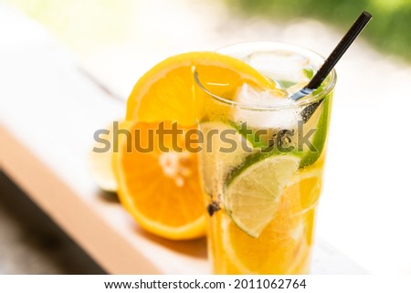 Similar – Infused fruit water cocktails and woman drinking green smoothie