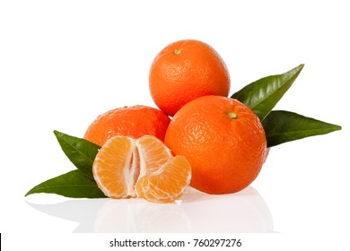 Orange Mandarines, Clementines, Tangerines Or Small Oranges With One Peeled And Cut In Half With Leaves Isolated On White Background, Cut Out Or Cutout