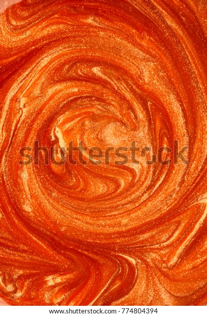 orange and metallic nail\
polish texture