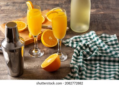 Orange Mimosa Cocktail On Wooden Table