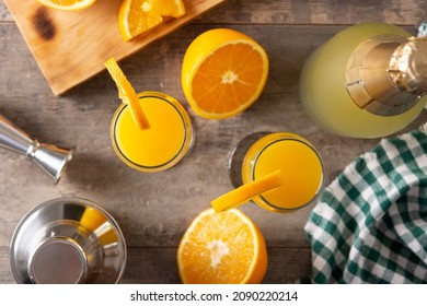 Orange Mimosa Cocktail On Wooden Table