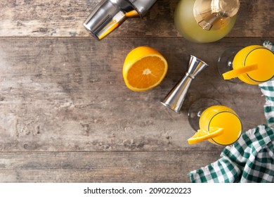 Orange Mimosa Cocktail On Wooden Table. Top View. Copy Space