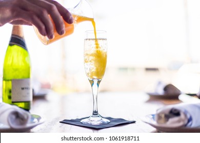 Orange Mimosa Pouring