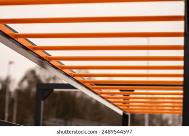 Orange monkey bars at an obstacle course