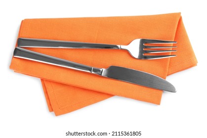 Orange napkin with fork and knife on white background, top view - Powered by Shutterstock