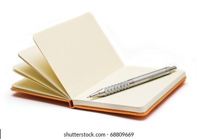 Orange note book with pencil.  Look through my portfolio to find more images of the same series
