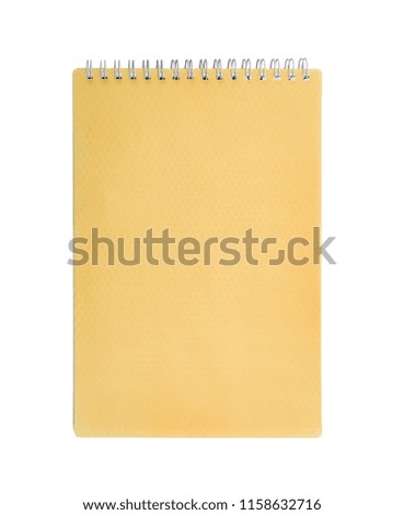 Orange notepad with spring isolated on white background. 