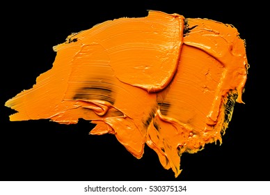 Orange Oil Paint Spot Isolated On A Black