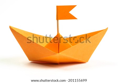 Orange origami paper boat isolated on white