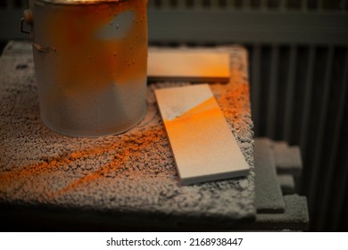 Orange Paint In Jar And Board. Workplace With Paint. Production In Paint Shop.