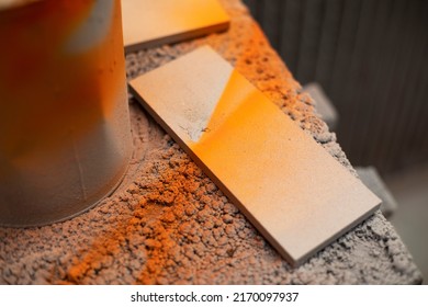 Orange Paint In Jar And Board. Workplace With Paint. Production In Paint Shop.