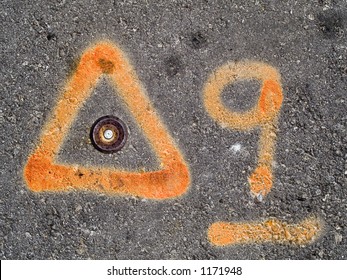 Orange Paint Marks On Asphalt, Used By Construction Or Survey Crew.