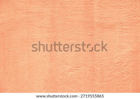 orange painted wall as harmonic structured background