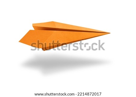 Orange paper plane origami isolated on a blank white background