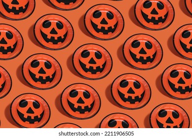 Orange Paper Plates With Drawn Pumpkins. Halloween Pattern.