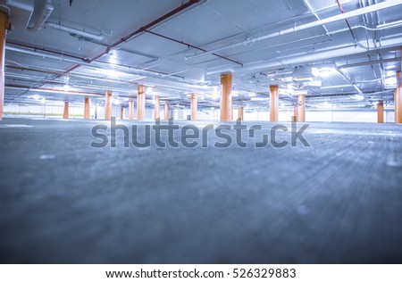 Similar – Empty multi-storey car park with yellow columns