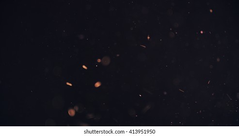orange particles like spark slowly float in air, 4k photo - Shutterstock ID 413951950