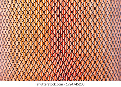 Orange Pattern Of Porous Material Covered By Black Mesh. Truck Air Filter Closeup. Designer Drawing Pattern On The Desktop Wallpaper.