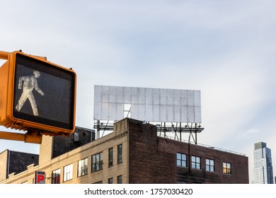 Orange Pedestrian Traffic Light And Empty Billboard On A Roof. Exit To Heaven.