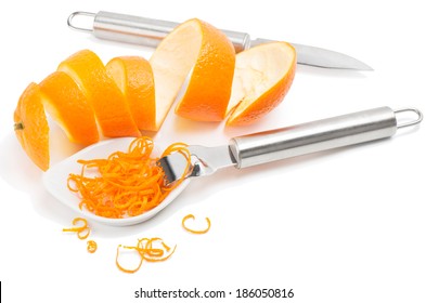 Orange Peel And Zest With Zester Isolated On A White Background, Top View.