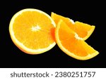 Orange pieces isolated with clipping path no shadow in black background, healthy fruit