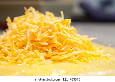  An Orange Pile Of Cheese That Has Been Shredded, With Copy Space