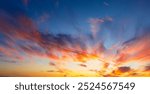 Orange and pink sky and clouds background. Colorful sky concept background. Beautiful sunset with dusk sky and clouds,Colorful clouds and sky,Dusk, Sunset Sky Clouds in the Evening with colorful Orang