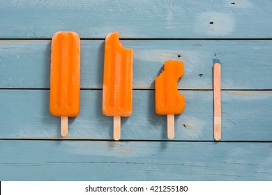 Orange Popsicles On Blue Wooden
