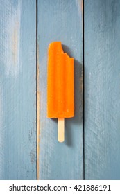 Orange Popsicles On Blue Wooden
