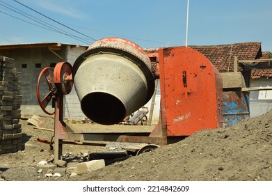 Orange Portable Cement Mixer Machine At Construction Site