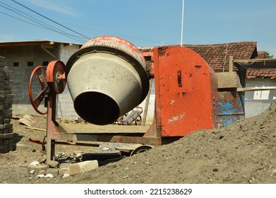 Orange Portable Cement Mixer Machine At Construction Site