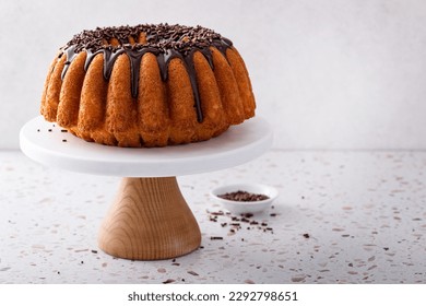 Orange pound bundt cake with dark chocolate ganache and chocolate sprinkles - Powered by Shutterstock