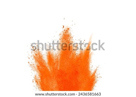 Orange powder explosion on white background. Colored cloud. Colorful dust explode. Paint Holi