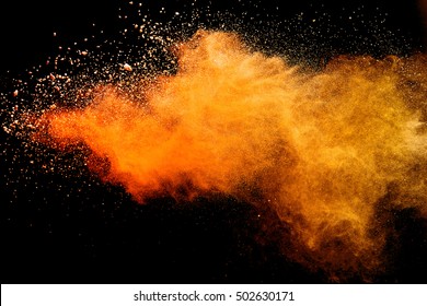 Orange powder isolated on black background