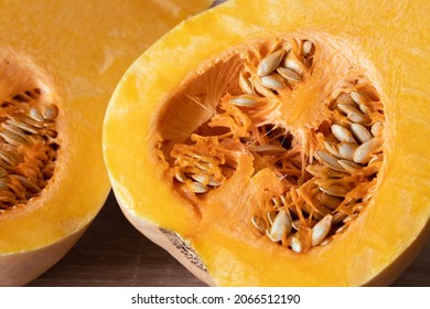 Orange Pumpkin With Seeds Cut In Half Close-up