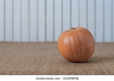 Orange Pumpkin with space for a text in rustic vintage style. Retro concept background. For poster, menu and recipe