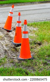 Orange Pylon On Grass Showing Construction