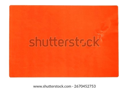 Orange rectangular paper sticker label isolated on white.