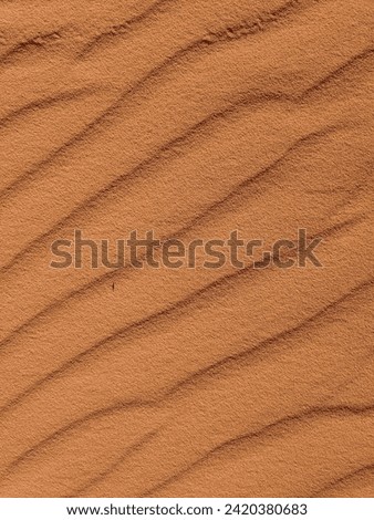 Orange and red color sand texture background. Wadi Rum desert, Jordan, scenic beautiful panorama,Close-up of redorange sand on desert
